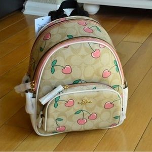 Lightly used Coach Signature Cherries backpack